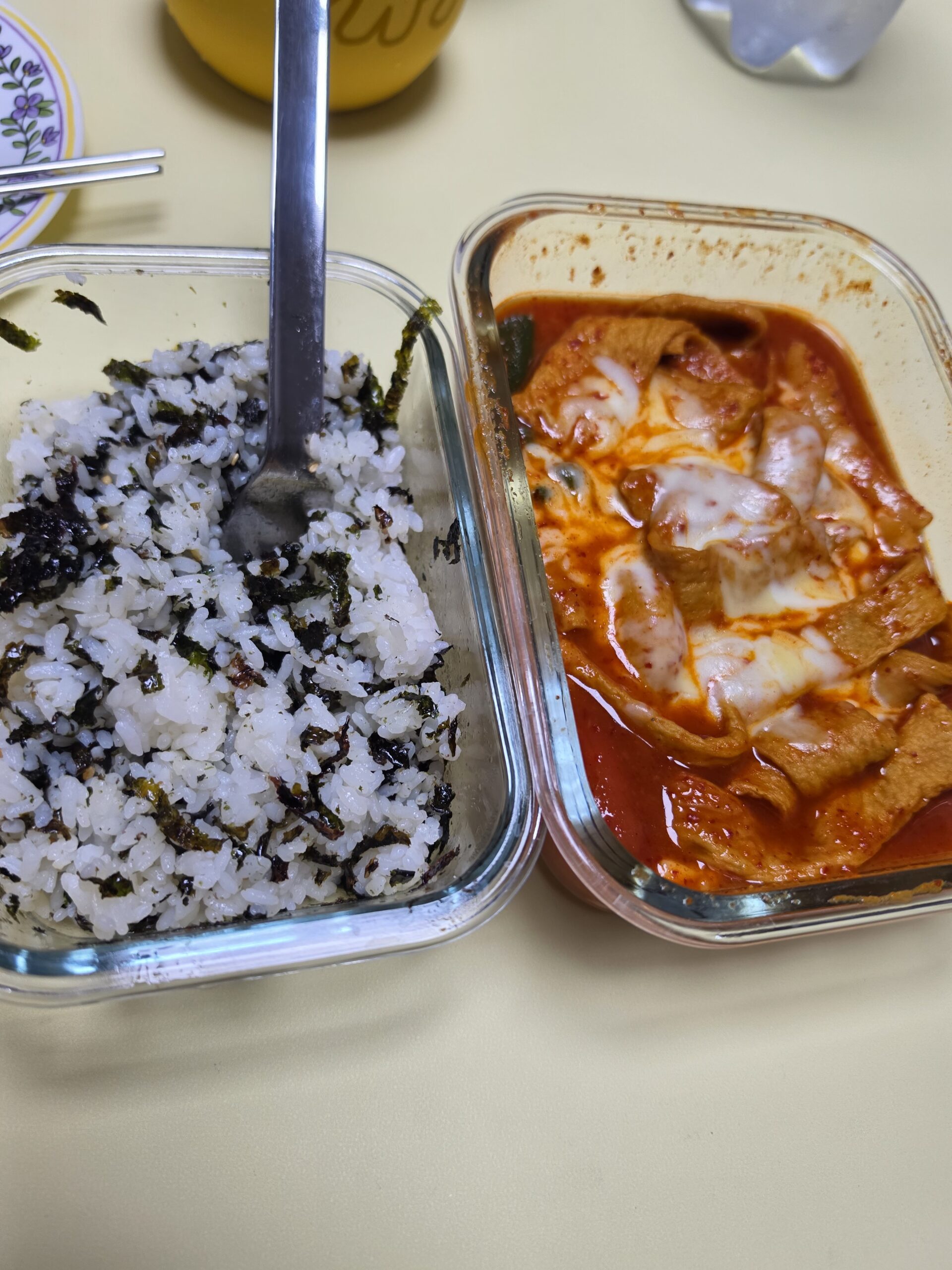 same containers, closer up — no plastic in sight, just dinner